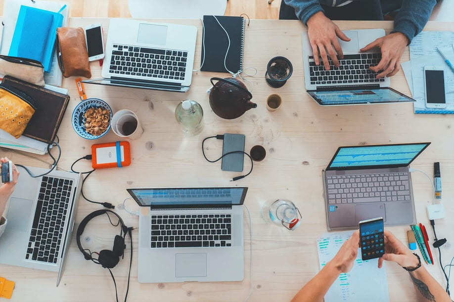 Creative team around a table at a project management meeting.