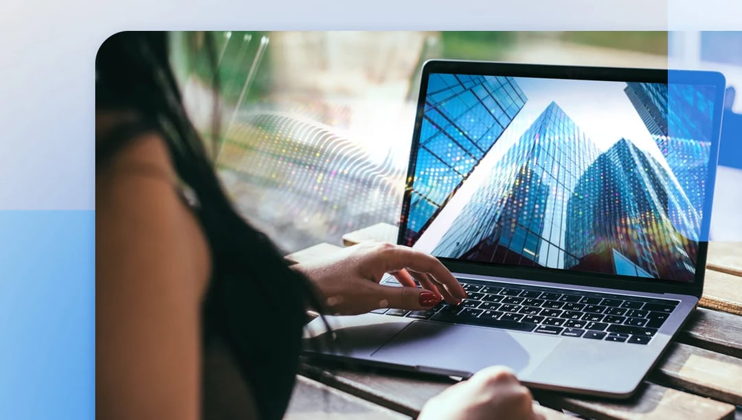 Creative designer making use of Ziflow Artificial Intelligence designing tool with a laptop-1