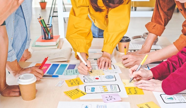 Design team using creative brief while leading the project