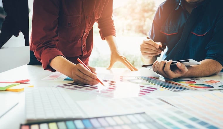 Designers cooperating on color palette for a design system