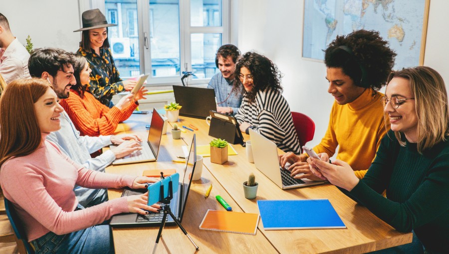 Group of creative team members using technology stack in a cooperation process