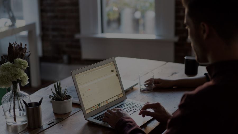 Marketing growth manager working remotely on a advertising strategy by his laptop