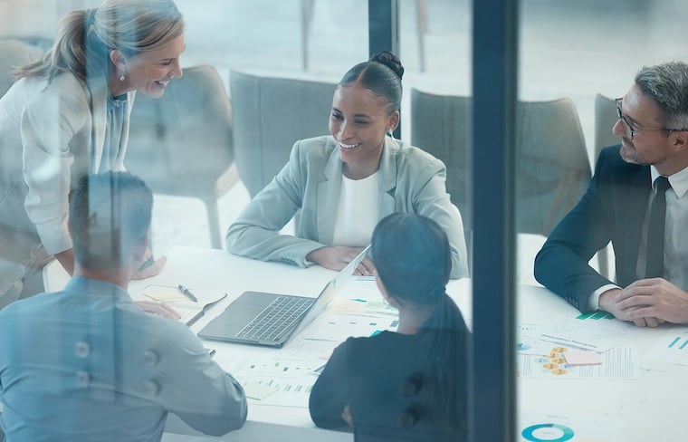 Marketing operations manager daily meeting with the team in a glass office