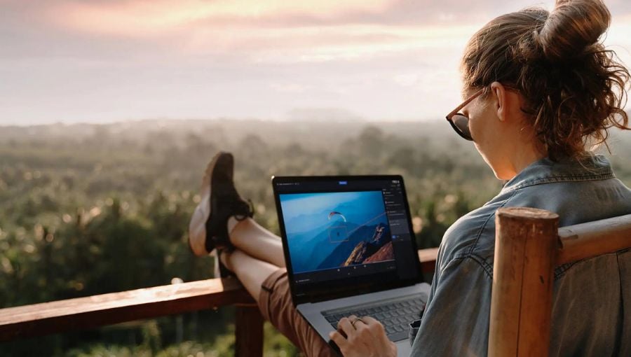 Designer using free forever edition of Ziflow on a laptop