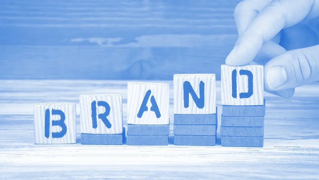 Word brand pieced together from blocks and stairs origin