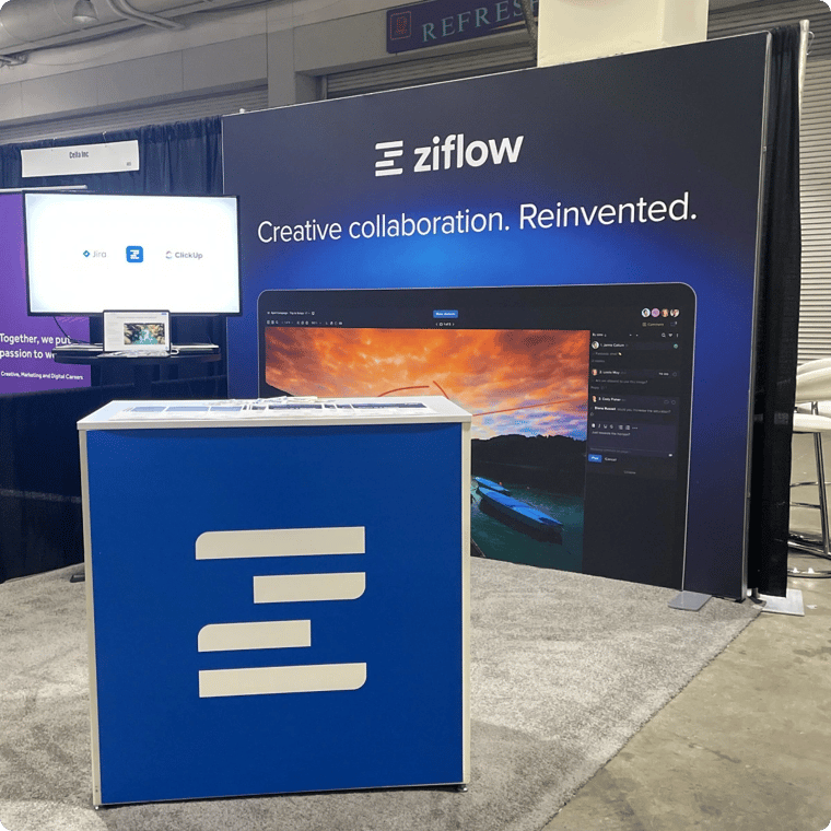 Ziflow stand on HOW Live design conference monitor, laptop and promotional stall
